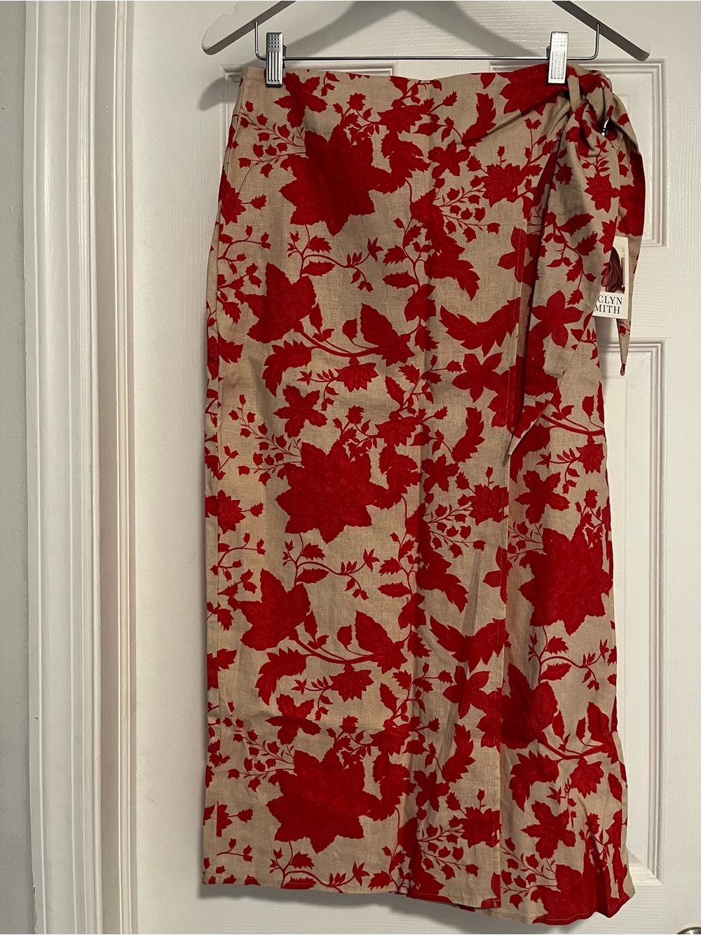 Red Floral Wrap Skirt on Beige Background